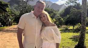 The Golden Bachelorette's chock chapple and joan vassos outside with mountains in background