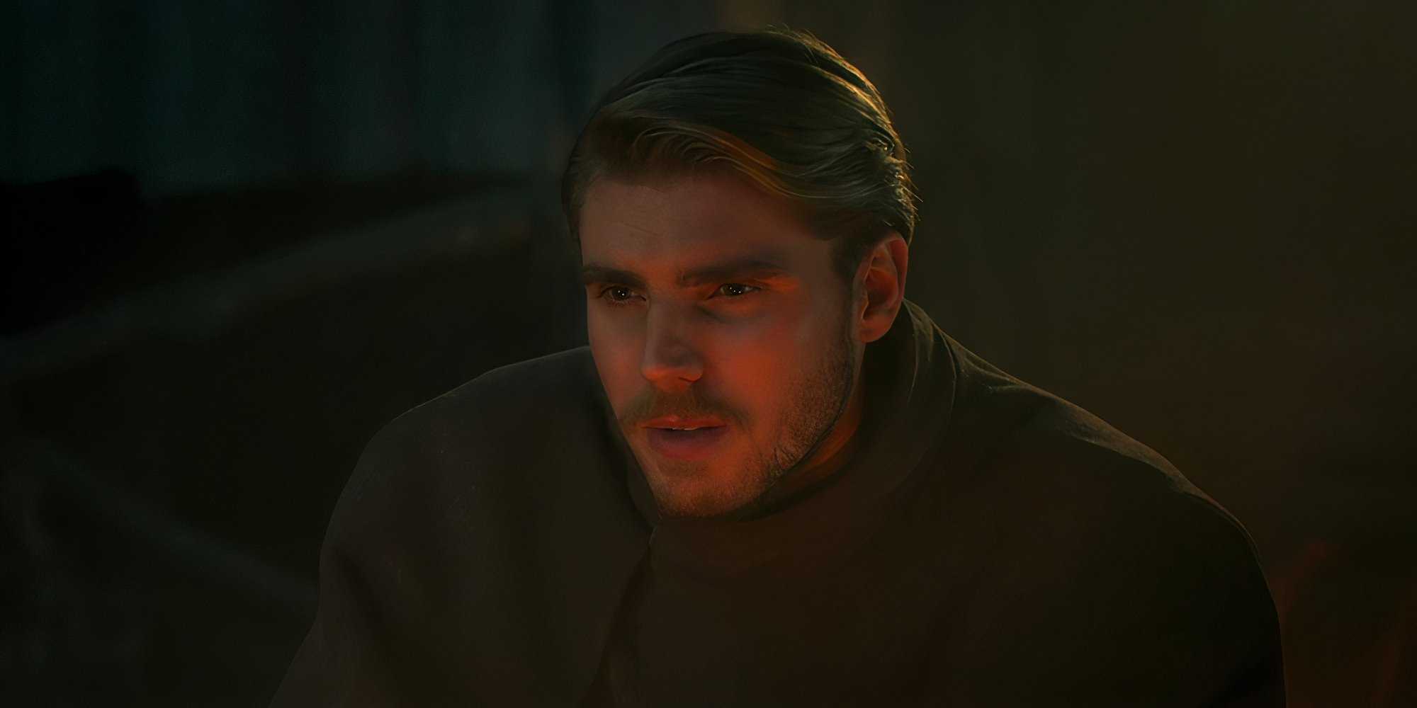 Dain Bornhald looking thoughtful by firelight in The Wheel of Time