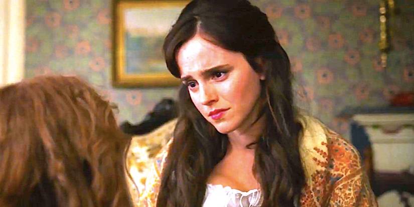 Emma Watson's Meg looking concerned sitting on a bed in Little Women 2019