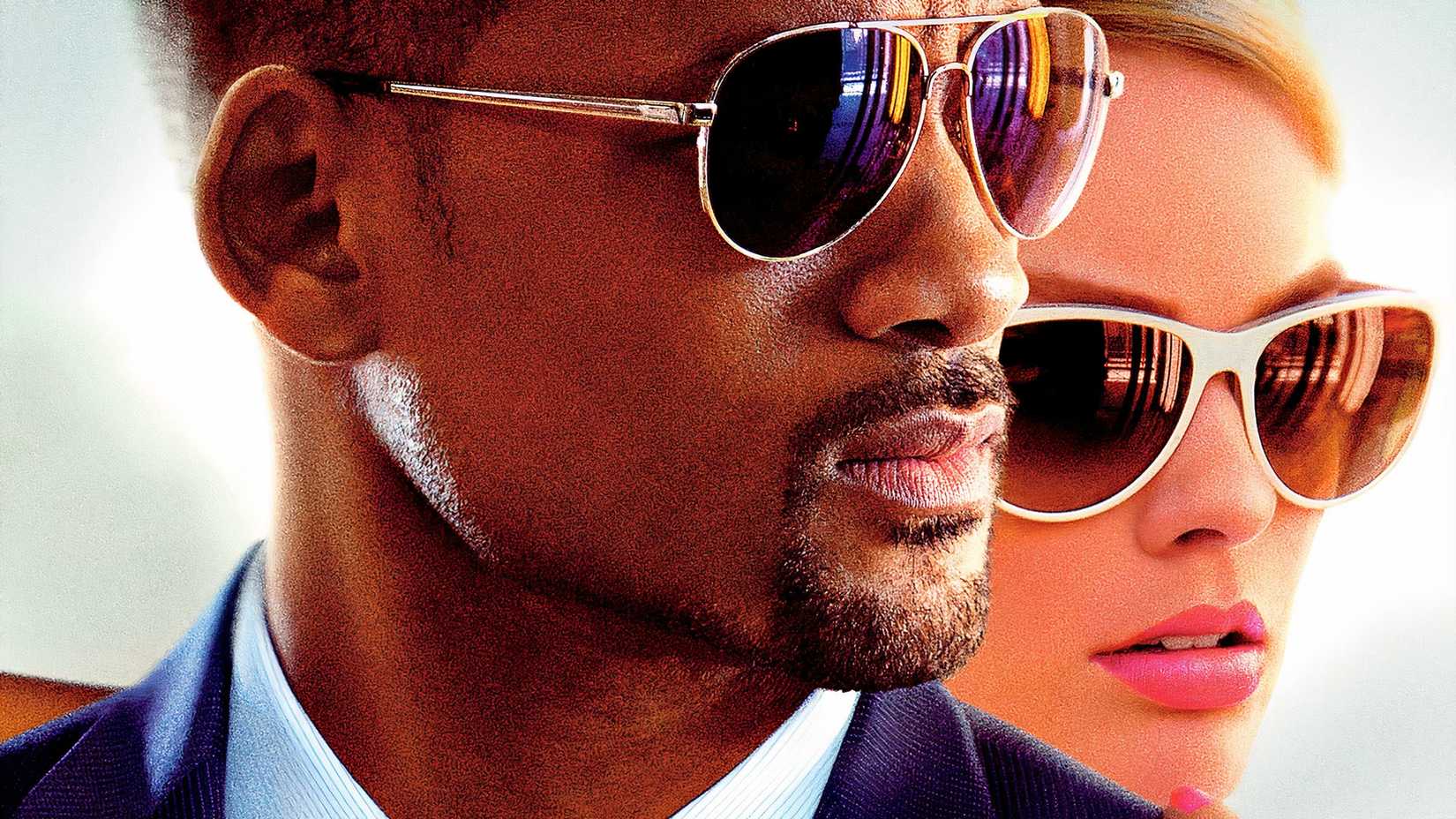 A close-up of Will Smith and Margot Robbie on the poster for Focus.