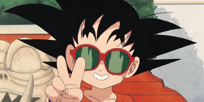 Goku wearing Roshi's glasses and holding up a peace sign in Dragon Ball.