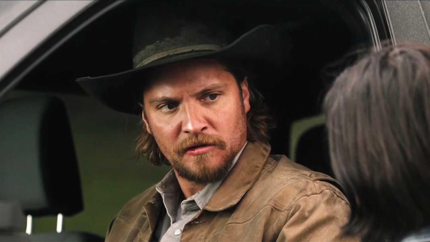 Kayce looking upset in his truck in Yellowstone