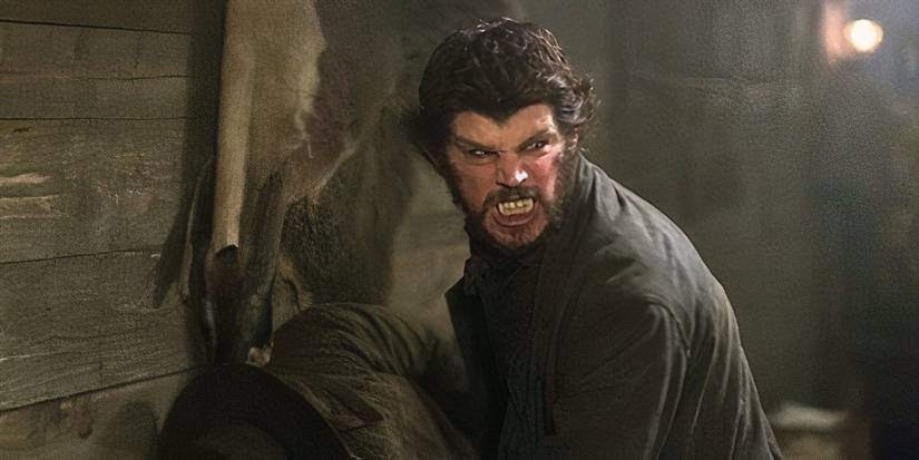 A werewolf turns his head back and shows off his teeth in Penny Dreadful