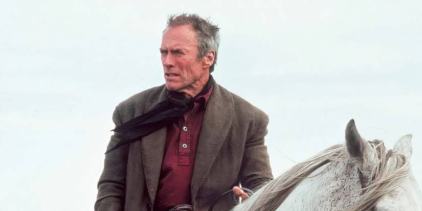 Clint Eastwood squinting atop a horse in Unforgiven