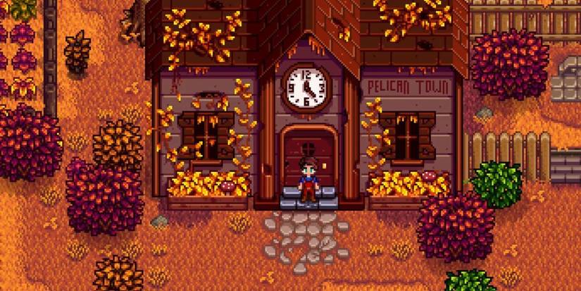 Um jogador de Stardew Valley em pé no centro da comunidade entra no outono.
