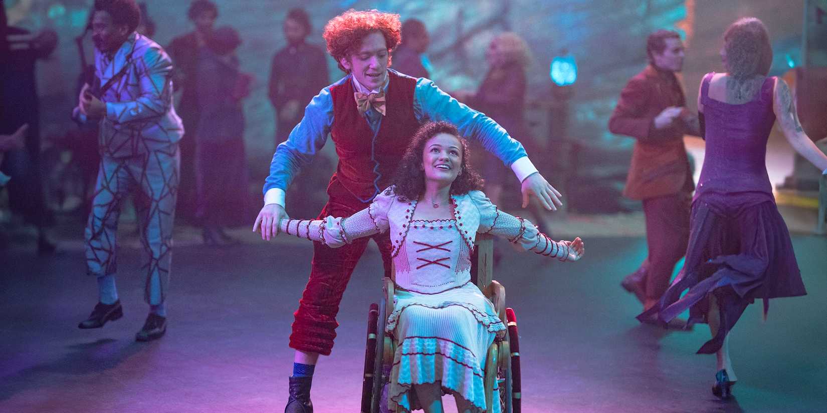 Boq ( Ethan Slater) and Nessarose (Marissa Bode) dancing in Wicked
