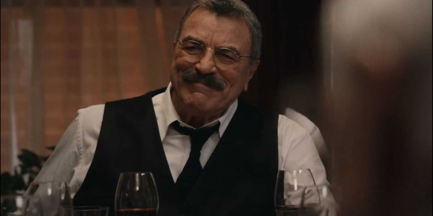 Frank smiling in suit and vest during the final Blue Bloods family dinner