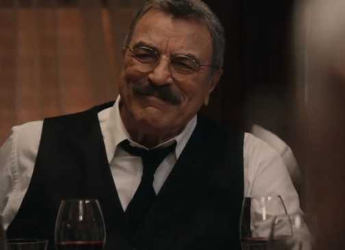 Frank smiling in suit and vest during the final Blue Bloods family dinner