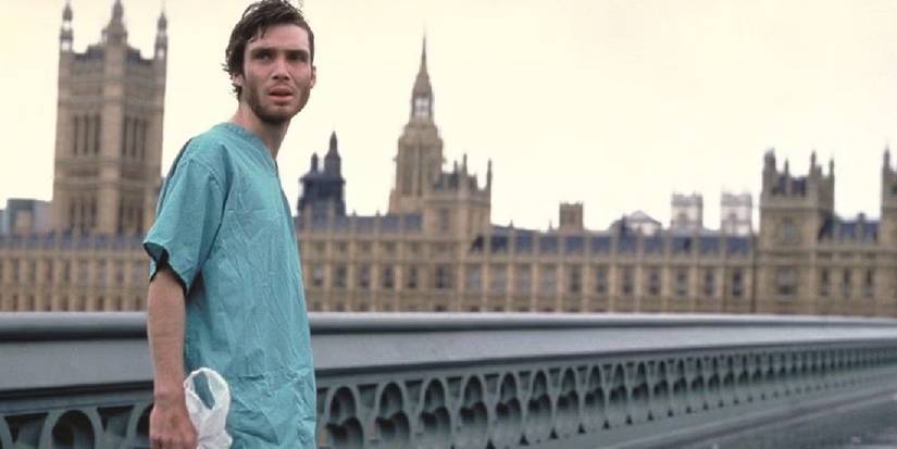 Cillian Murphy as Jim walks through abandoned London with the Houses of Parliament behind him in 28 Days Later