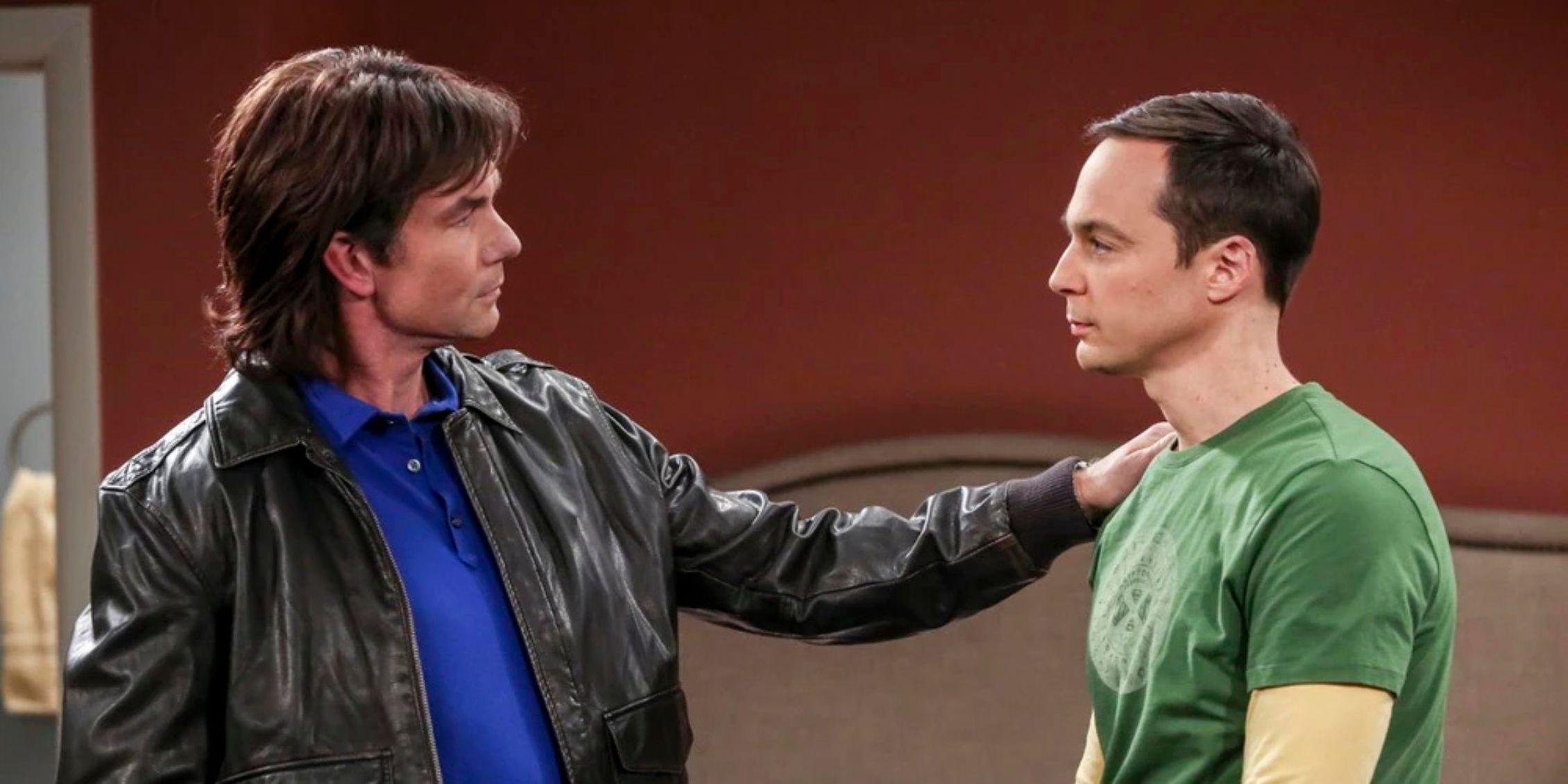 Big Bang Theory Georgie with his hand on Sheldon's shoulder