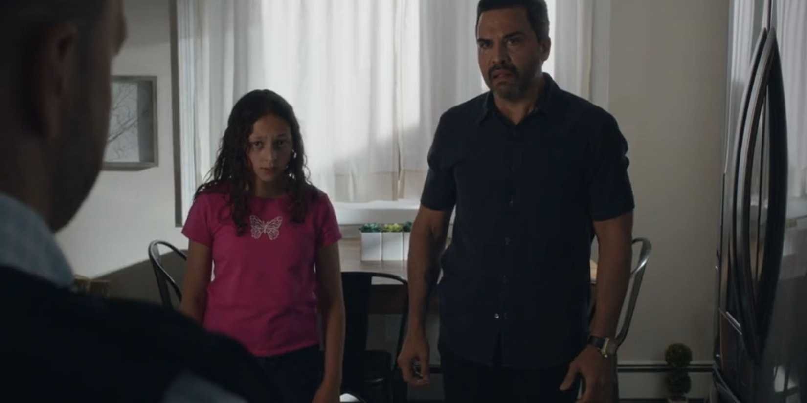 Blue Bloods Ramirez and Amelia stare at Danny in their kitchen