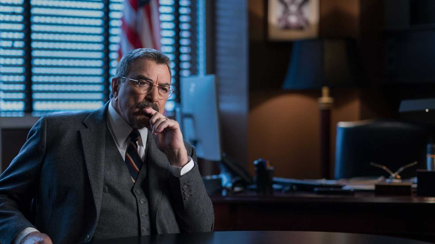 Blue Bloods Frank sitting at his desk and thinking