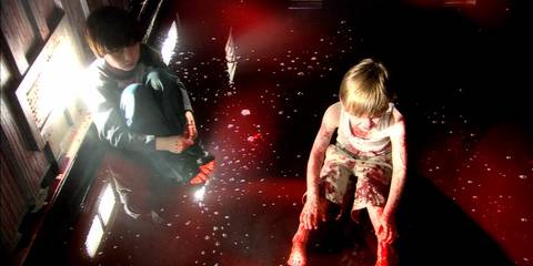 Young Brian and Dexter Moser sitting in a pool of their mother's blood in Dexter season 1, episode 12