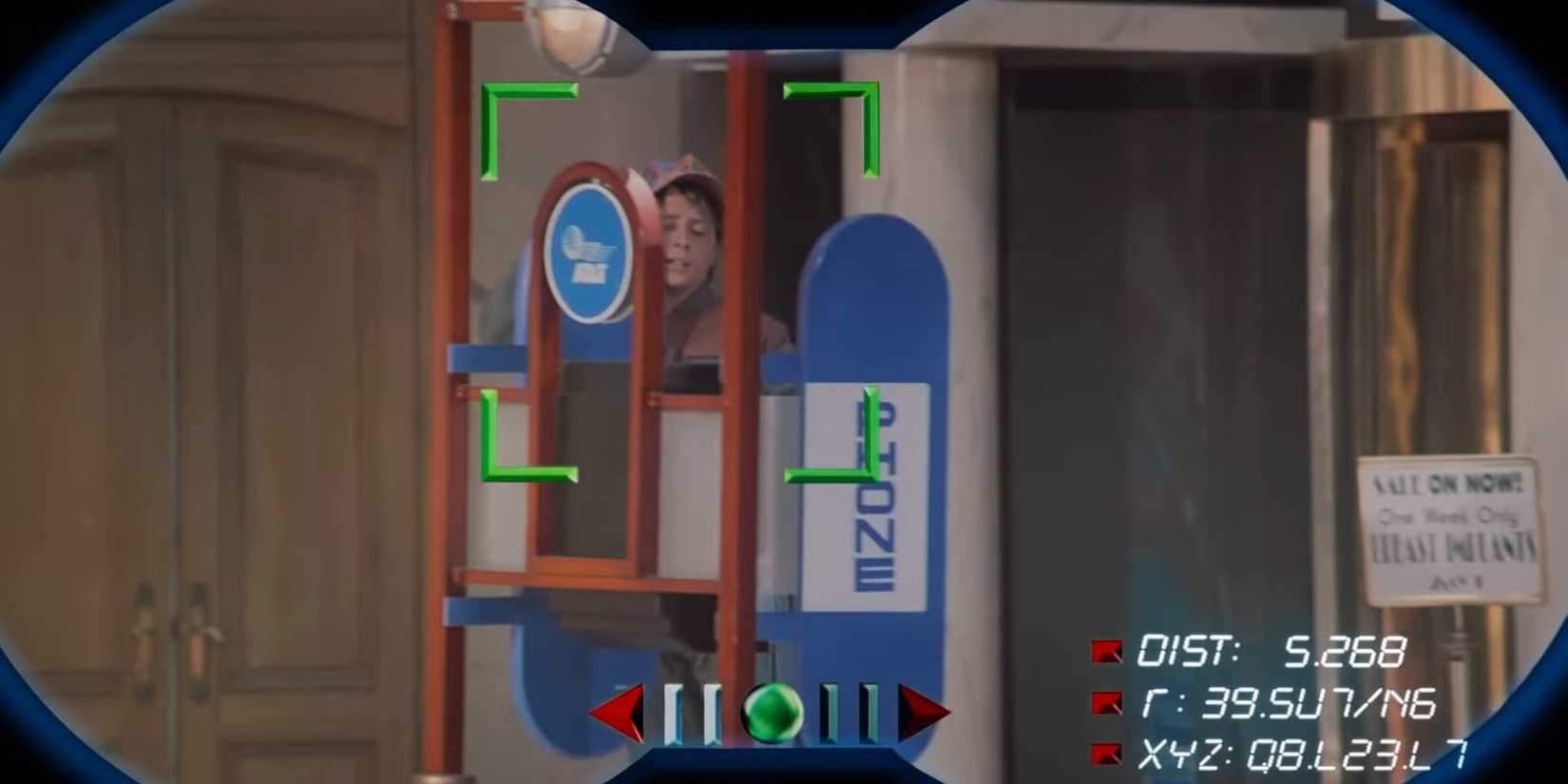 Marty McFly Jr. (Michael J. Fox) in a payphone booth next to a sign that reads "Sale on now! One week only. Breast implants" in Back to the Future Part II