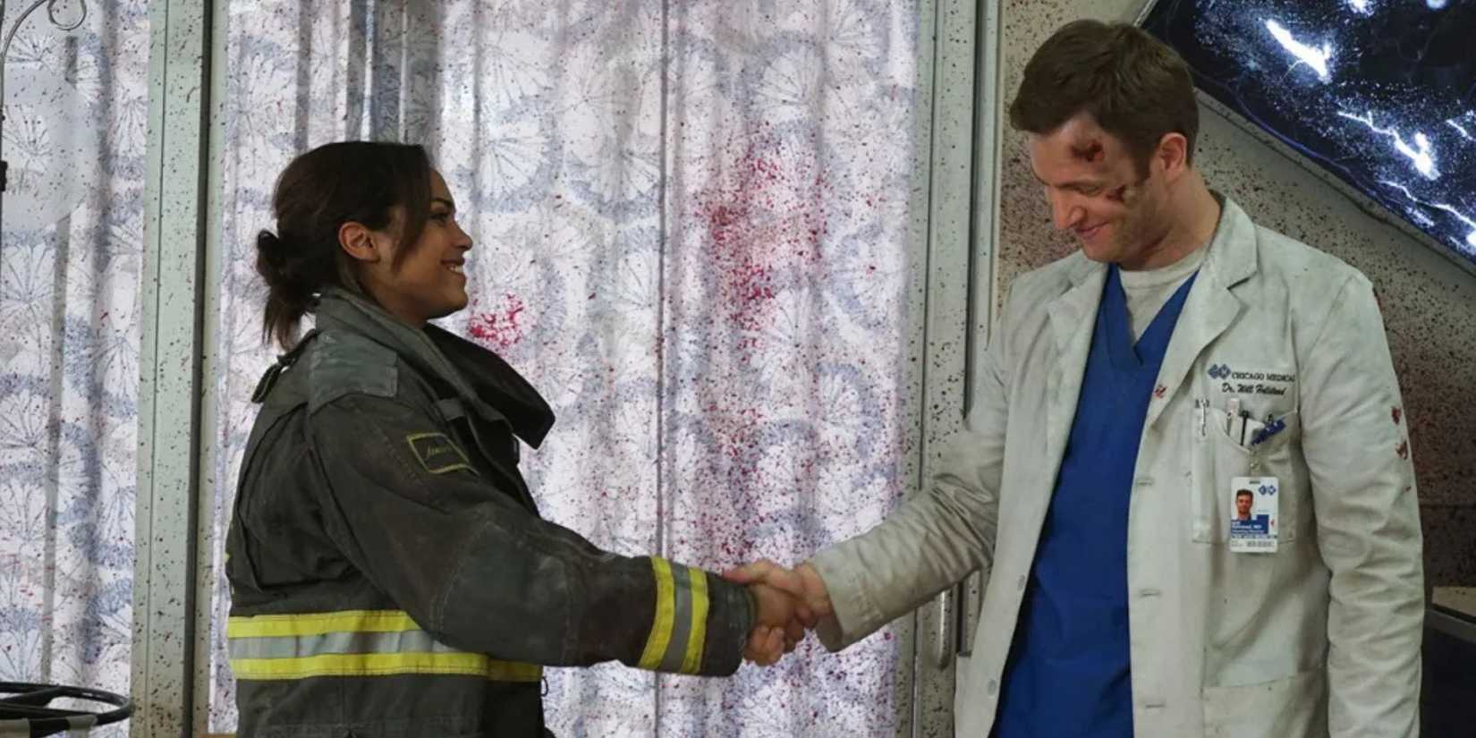 Chicago Med Will has burns on his face as he shakes hands with a firefighter