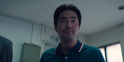 Choi Woo-seok smiling in Squid Game season 2