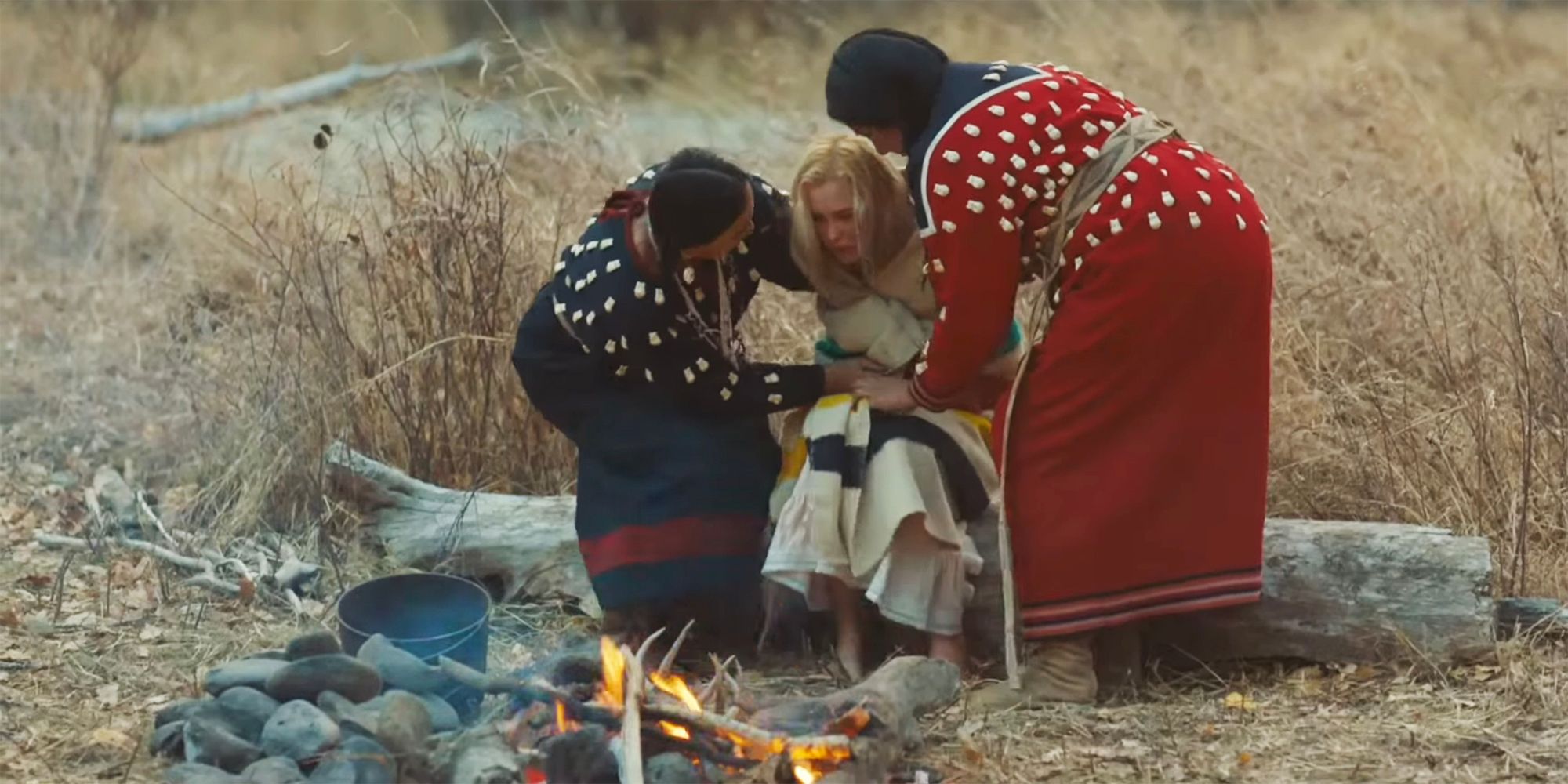 Crow women helping Elsa Dutton stand in 1883