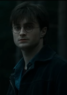 Daniel Radcliffe as Harry Potter in Harry Potter and the Deathly Hallows: Part 1 (2010) in the forest, ambushed by enemies