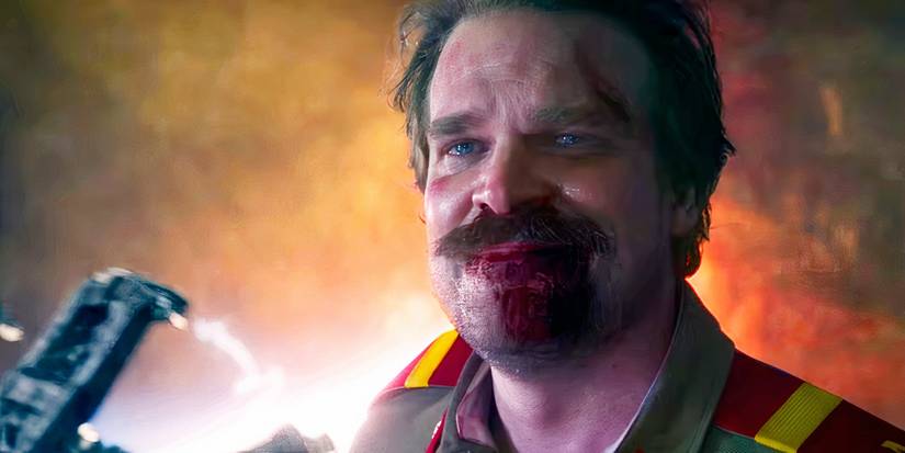 David Harbour smiling with tears in his eyes as Hopper in Stranger Things season 3