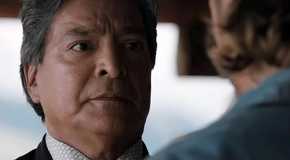 Gil Birmingham as Thomas Rainwater looking seriously at Luke Grimes' Kayce in the Yellowstone series finale