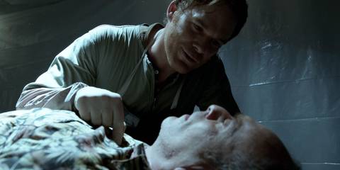 Dexter Morgan (Michael C. Hall) poking Hector Estrada (Nestor Serrano) in Dexter season 7, episode 11