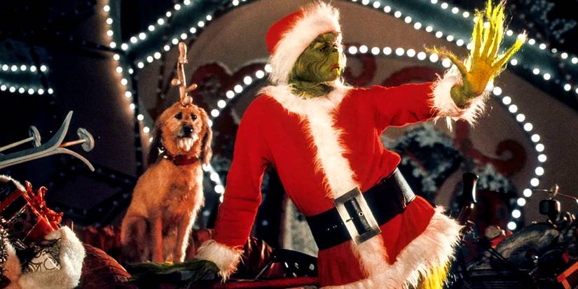 Max ao lado do Grinch interpretado por Jim Carrey em Como o Grinch Roubou o Natal