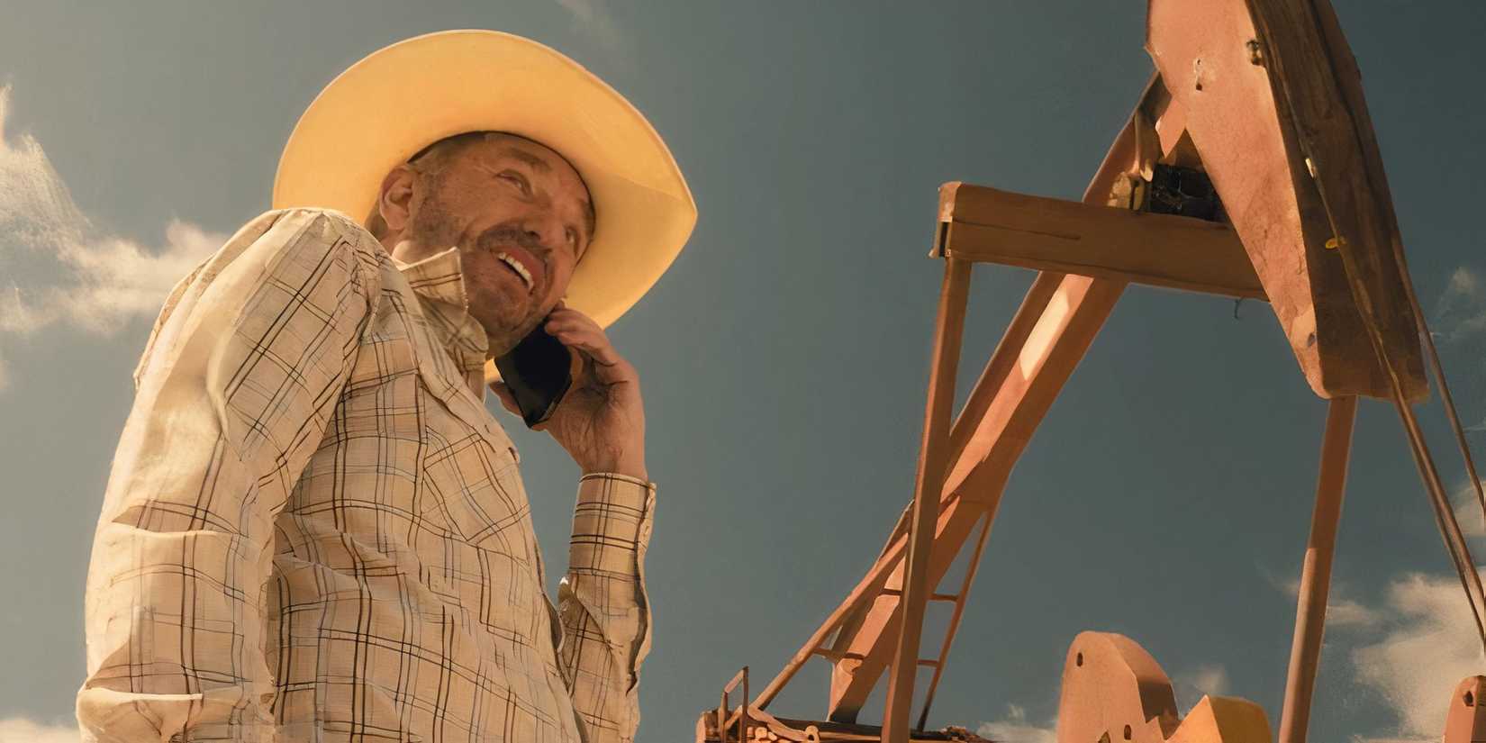 Tommy Norris (Billy Bob Thornton) on the phone in front of an oil derrick in Landman episode 3