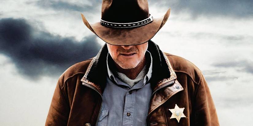 Walt Longmire with his head down on a poster for Longmire.