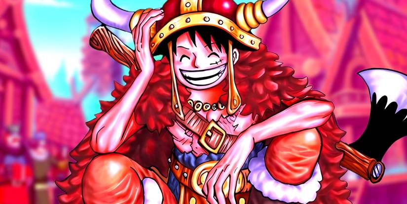 Luffy dans sa tenue Elbaph souriant en s'accroupissant. Derrière lui, on aperçoit un village géant. 