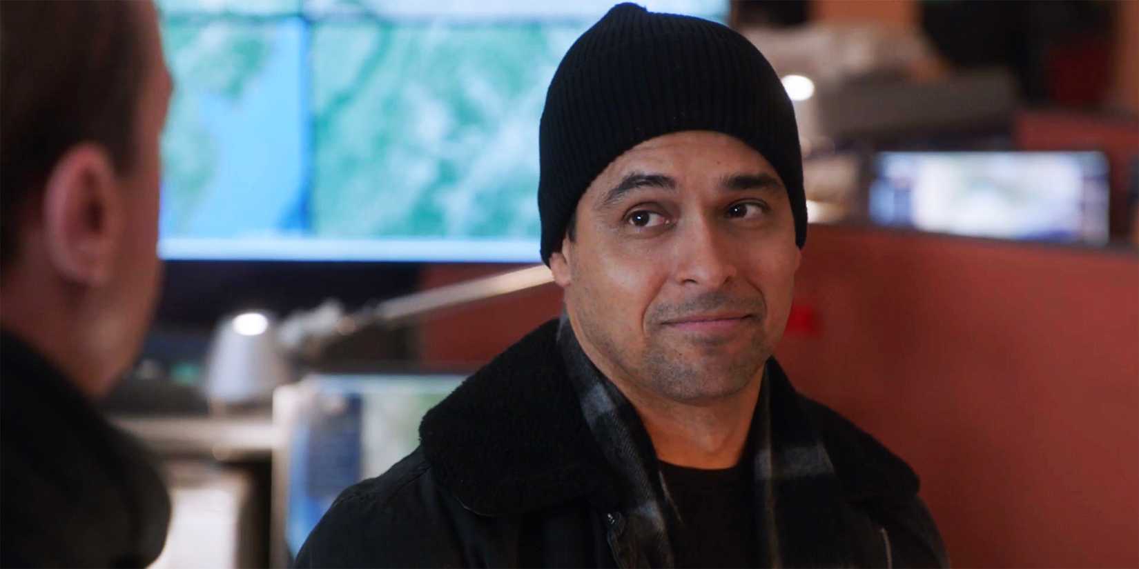Nick Torres in a beanie smirking in NCIS season 22