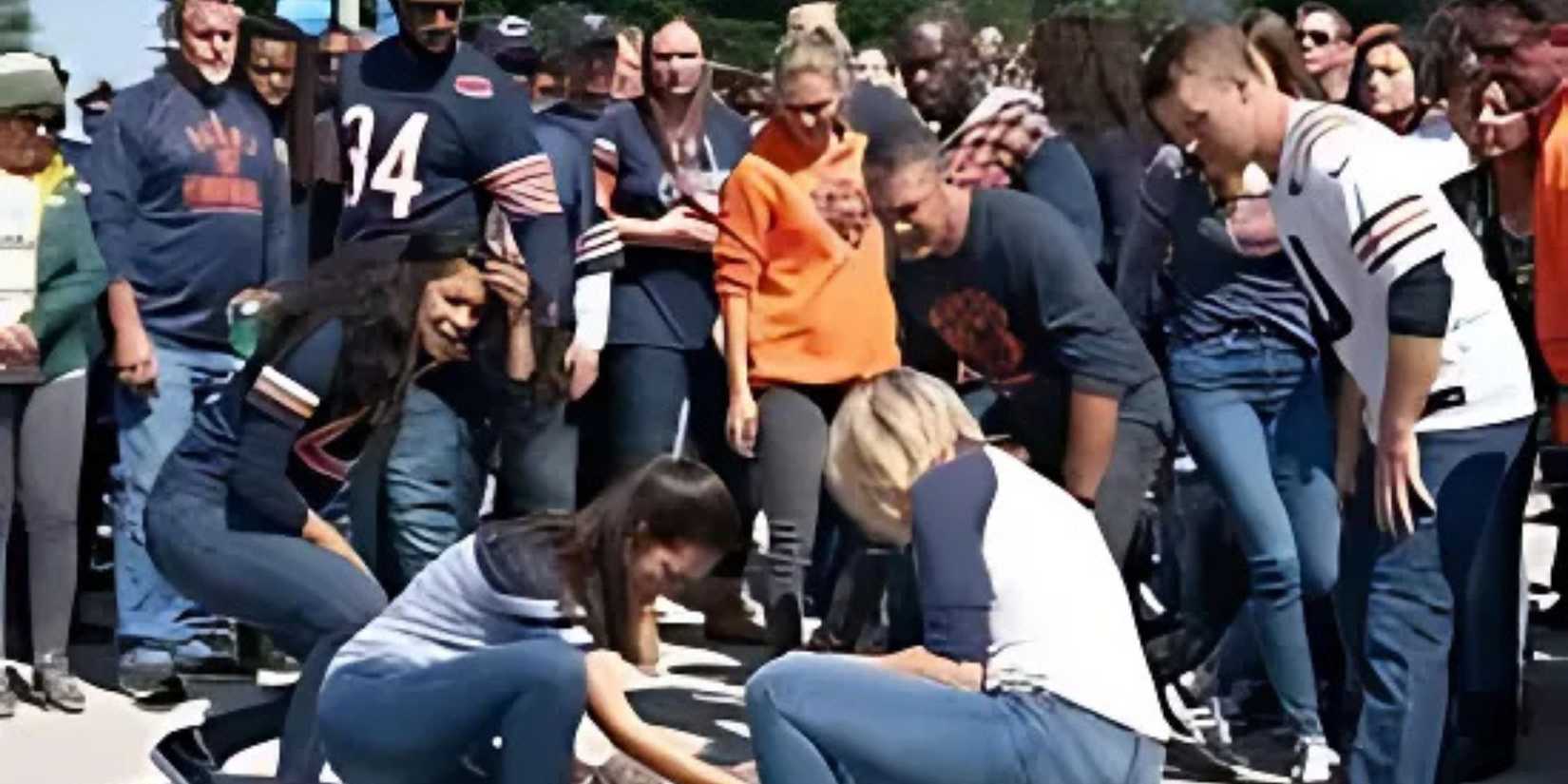 One Chicago a crowd gathers around a collapsed person