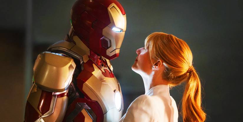 Pepper Potts with the empty Iron Man suit in Iron Man 3