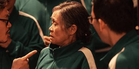 Geum-ja looking at her son who is pointing in Squid Game season 2