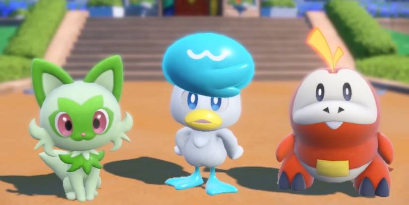 Die Pokémon-Starter Scarlet und Violet Sprigatito, Quaxly und Fuecoco in einer Reihe.