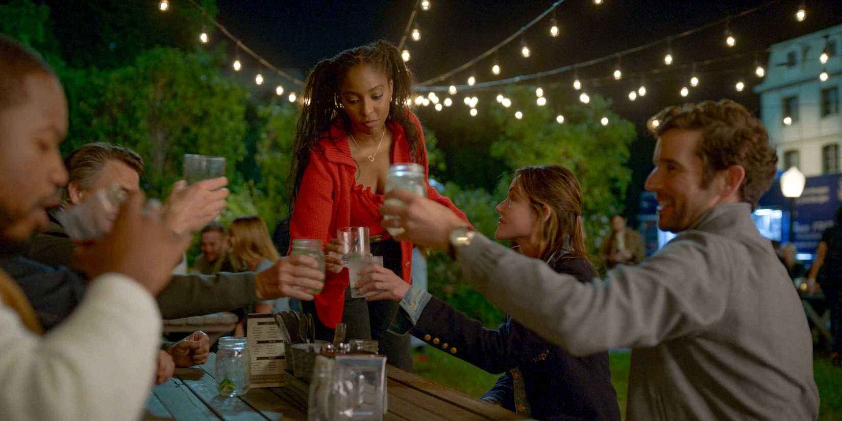 Gaby (Jessica Williams) toasting with her friends because Brian and Charlie are going to be dads in Shrinking Season 2 Ep 11