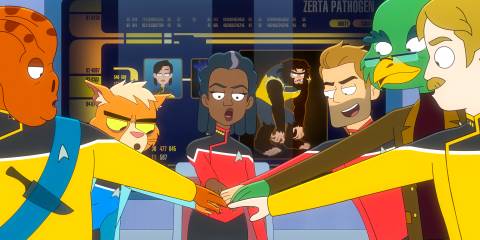 The bridge crew putting their hands together in the center in Star Trek: Lower Decks Season 5 Ep 8
