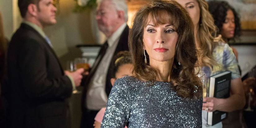 Susan Lucci as Genevieve Delatour at a party in Devious Maids