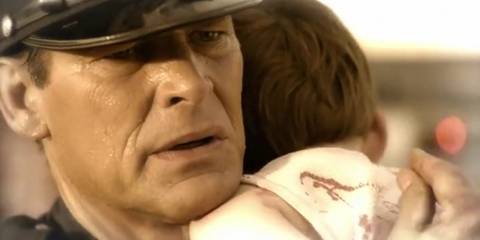 Young Harry Morgan carrying Dexter from the crime scene in Dexter flashback