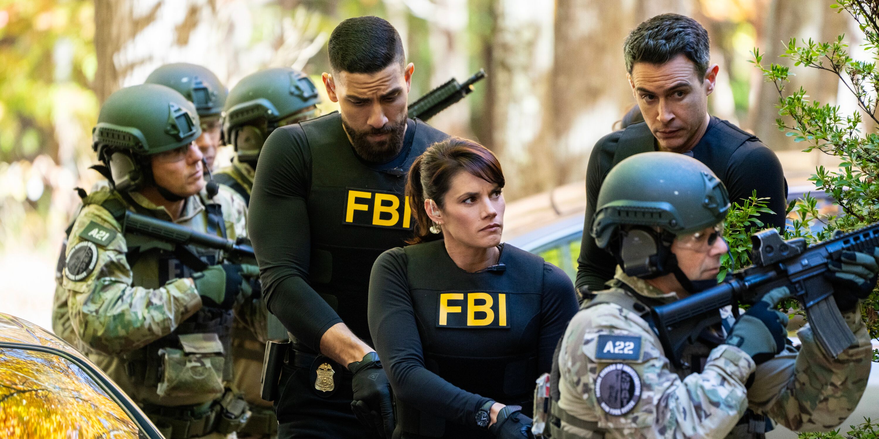 FBI OA, Maggie, and Scola at a raid with men in camouflage 