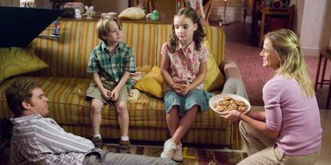 Dexter, Cody, Astor, and Rita sitting around a couch in Dexter