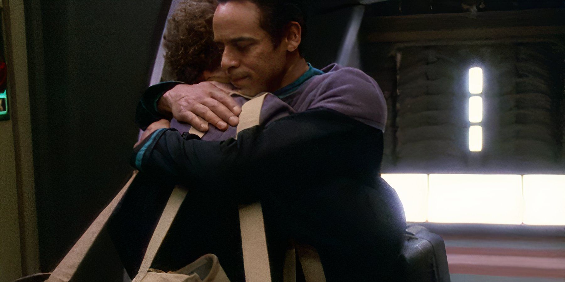 Dr Julian Bashir (Alexander Siddig) hugs Chief Miles O'Brien (Colm Meaney) goodbye in DS9 What You Leave Behind finale