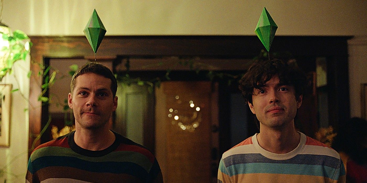 Диллан О'Брайен и Джеймс Свини стоят рядом, над головами у них иконки игры "The Sims"