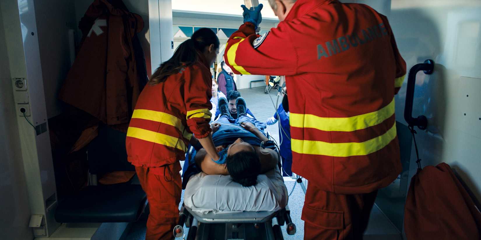 Cameron Vo on a stretcher in FBI: International season 4, episode 8