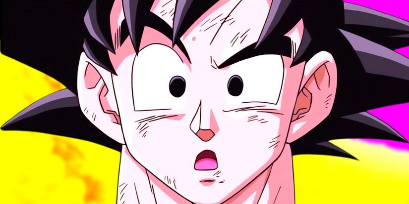 Goku standing in front of the camera looking confused. Behind him, the sky of the other world can be seen. 