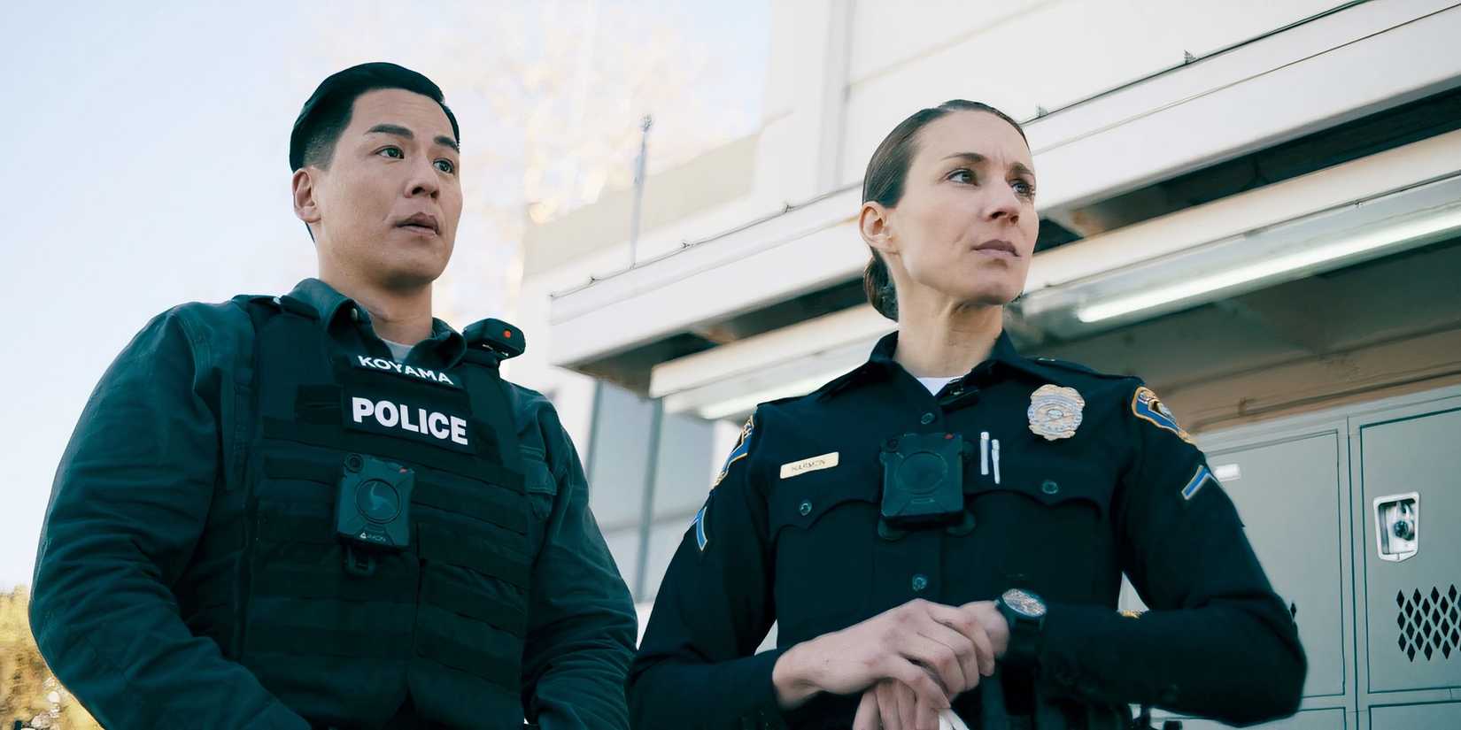 Harmon and Tyson standing together in On Call season 1, episode 8