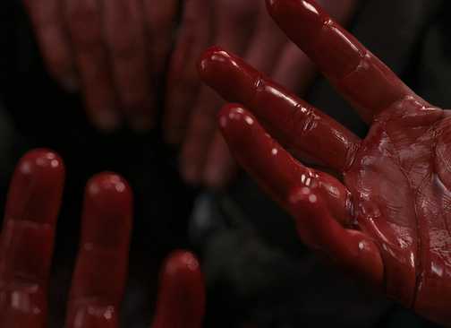 Jamie's bloody hands in Outlander