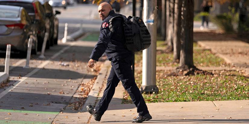 Joe Minoso as Cruz in Chicago Fire season 13 episode 9 walking with his backpack on