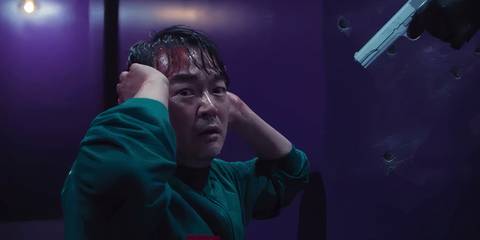 Jung-bae with a gun pointed at him in Squid Game season 2's finale