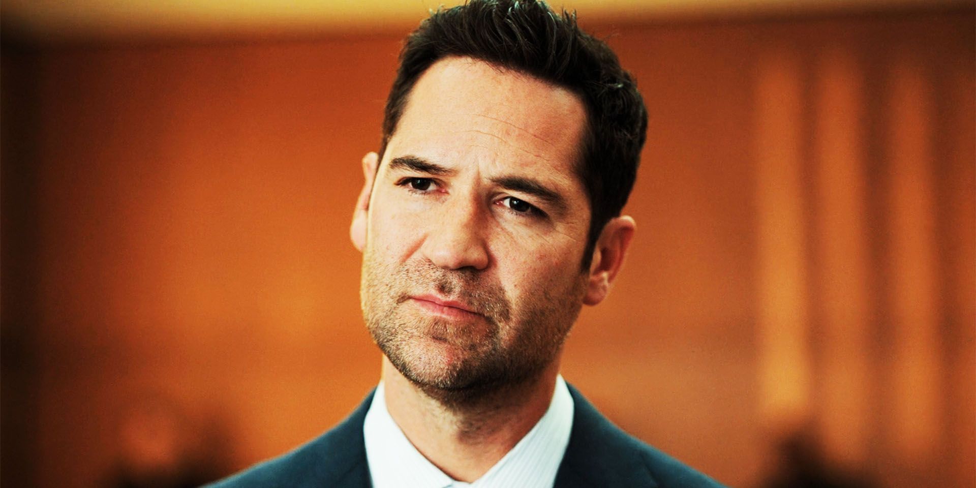 Manuel Garcia-Rulfo in The Lincoln Lawyer season 3, episode 10, looking at a witness