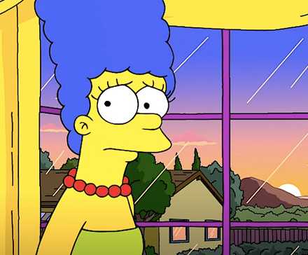 10 Best American Sitcoms Of All Time 8 Marge stands by a window looking concerned in The Simpsons season 36